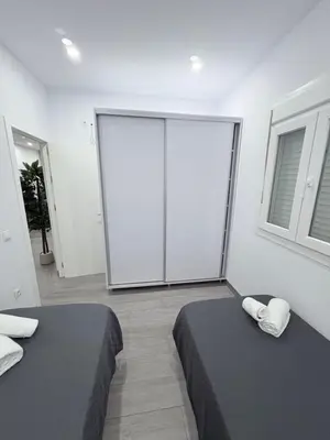 a pair of white doors in a room at Erika & Julia in Chiclana de la Frontera