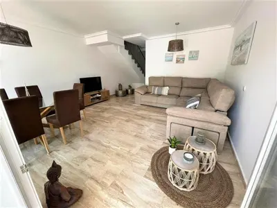 a living room with a couch and a table at Villa Libertad in Conil de la Frontera