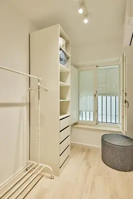 a room with a large white closet and a stool at Redo Home in Cádiz