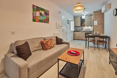 a living room with a couch and a table at Redo Home in Cádiz