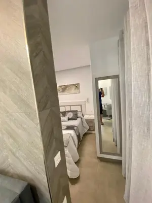 a person taking a picture of a bedroom at Loft Deluxe Raquel in Conil de la Frontera