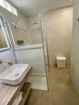 a white bathroom with a sink and a shower at Loft Deluxe Raquel in Conil de la Frontera