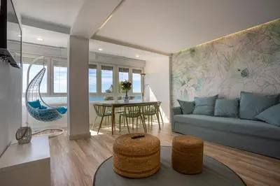 a living room with a couch and a table at ACQUARELA Family Home free parking by Cadiz4Rentals in Cádiz