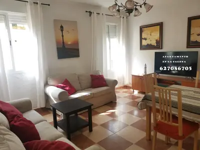 a living room with a couch and a table at Apartamento en la Caleta in Cádiz