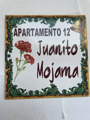 a sign on a wall that saysendar marina meena at El Tablao in Jerez de la Frontera