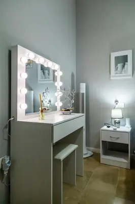 a room with a desk with a mirror and a sink at SH Lupe Caleta Beach. A 100 m de playa in Cádiz