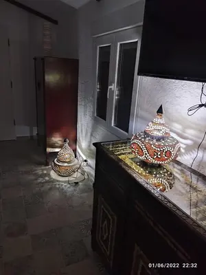 two vases sitting on a dresser in a room at Villa egipto con jacuzzi y piscina climatizada in Chiclana de la Frontera