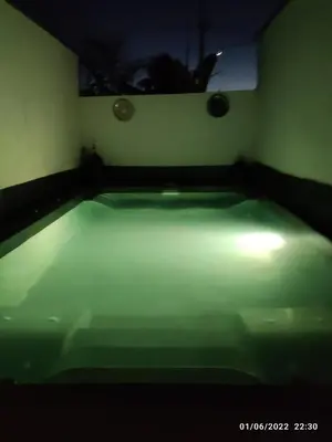 a dark room with a tub with a light on it at Villa egipto con jacuzzi y piscina climatizada in Chiclana de la Frontera