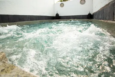 a large pool of water with foam in it at Villa egipto con jacuzzi y piscina climatizada in Chiclana de la Frontera