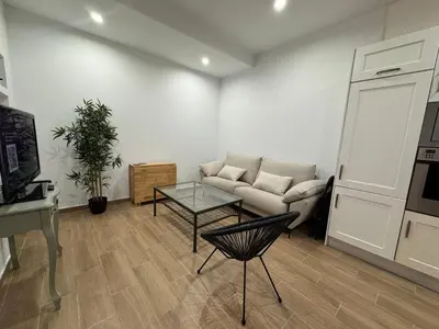 a living room with a couch and a table at Terra Centro Cádiz in Cádiz