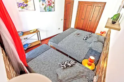 a bedroom with a bed and a rubber duck at Ribera De Luxe Central Apartment with Ascensor in El Puerto de Santa María