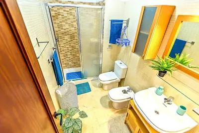 a bathroom with a sink and a toilet and a shower at Ribera De Luxe Central Apartment with Ascensor in El Puerto de Santa María