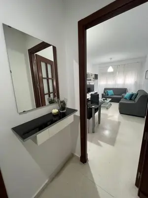 a living room with a sink and a mirror at Esteros de San Fernando in San Fernando