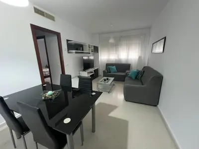 a living room with a table and a couch at Esteros de San Fernando in San Fernando