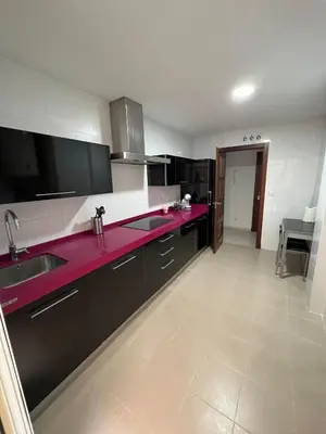 a kitchen with purple counter tops and a sink at Esteros de San Fernando in San Fernando
