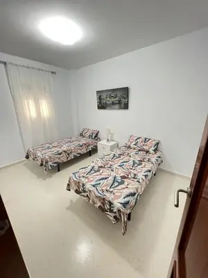 a room with two beds in a room with at Esteros de San Fernando in San Fernando
