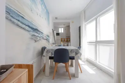 a dining room with a table and chairs at Atico del Buen CANTAOR by Cadiz4Rentals in Cádiz