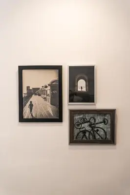 three framed photographs hanging on a white wall at Mina50 by 7Escalones in Rota
