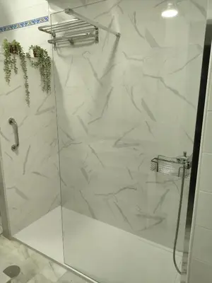 a shower with a glass door in a bathroom at Apartamento turístico la jara in Sanlúcar de Barrameda