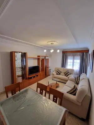 a living room with a couch and a table at Gallegos House in Lebrija