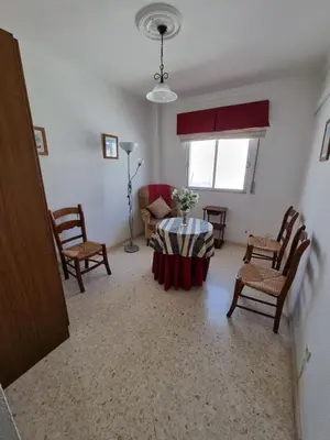 a bathroom with a sink and a toilet and a mirror at Gallegos House in Lebrija