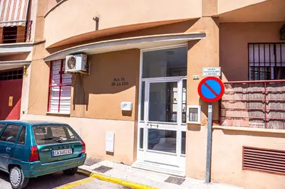 a car parked in front of a building at Apartamento AGUAMAR in Sanlúcar de Barrameda