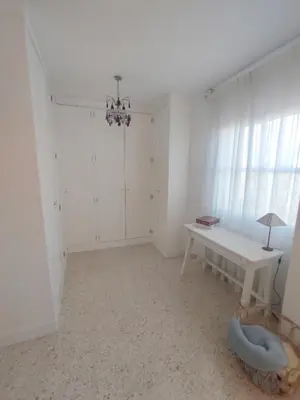a white room with a table and a window at Mirador Bajo de Guía in Sanlúcar de Barrameda