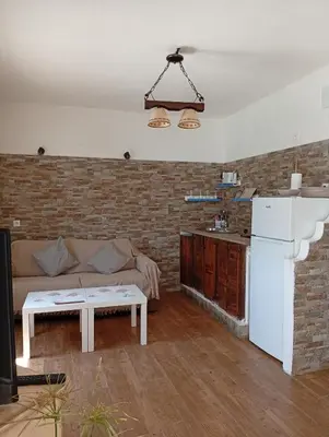 a living room with a couch and a table at Casa del abuelo trujillo 2 in Conil de la Frontera