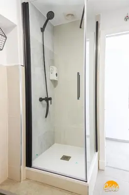 a shower with a glass door in a bathroom at Casa Rehala by Cadiz Time in Cádiz