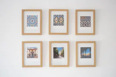 a group of framed photos on a wall at SibsSanlucar Casa Manuela - Céntrico - Vistas Coto Doñana in Sanlúcar de Barrameda
