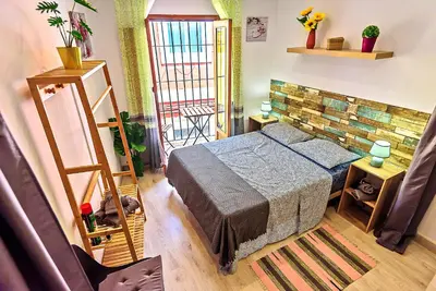 a bedroom with a bed in a room at Plaza Herrería Central Apartments with Balconies in El Puerto de Santa María