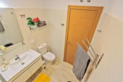 a bathroom with a toilet and a sink and a shower at Plaza Herrería Central Apartments with Balconies in El Puerto de Santa María