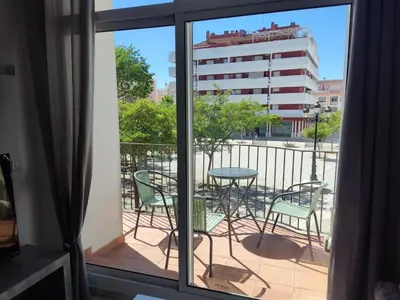 a view of a balcony with a table and chairs at LAS INFANTAS HOME in Sanlúcar de Barrameda