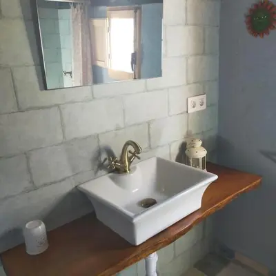 a white sink in a bathroom with a mirror at Vivienda Rural La choza in Jerez de la Frontera