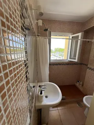 a bathroom with a sink and a shower at Apartamento Bajamar in El Puerto de Santa María