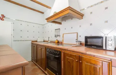 a kitchen with a microwave oven and a sink at Azvalia - Atarazana in El Puerto de Santa María