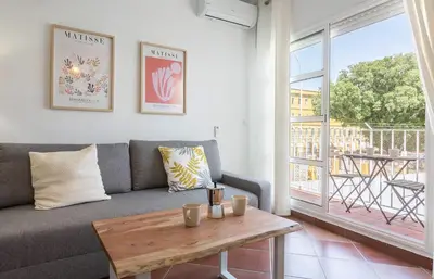 a living room with a couch and a table at Azvalia - Atarazana in El Puerto de Santa María