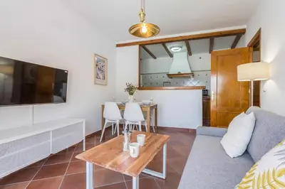 a living room with a couch and a table at Azvalia - Atarazana in El Puerto de Santa María