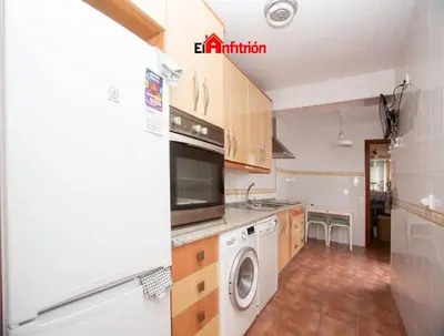 a kitchen with a washer and dryer in it at El Anfitrión - La Cómoda in Sanlúcar de Barrameda