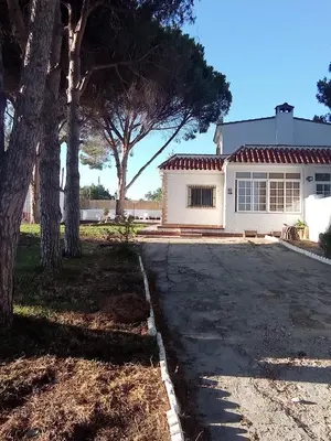 a house with a driveway in front of it at La Estrella - piscina privada in Chiclana de la Frontera