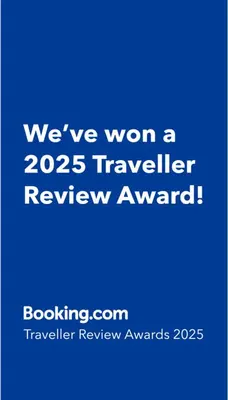 a blue sign that says weve won a traveler review award at La Estrella - piscina privada in Chiclana de la Frontera