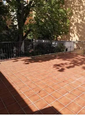 a net on a tennis court with a fence at Disfrutar de Sanlucar de Barrameda in Sanlúcar de Barrameda