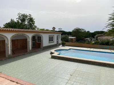 a large swimming pool in front of a house at La Ranaverde, piscina y playa in Chiclana de la Frontera