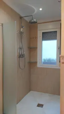 a bathroom with a shower and a window at Sherryflat Laurel in Jerez de la Frontera