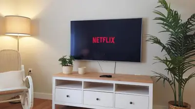 a tv sitting on top of a white dresser at Sherryflat Laurel in Jerez de la Frontera