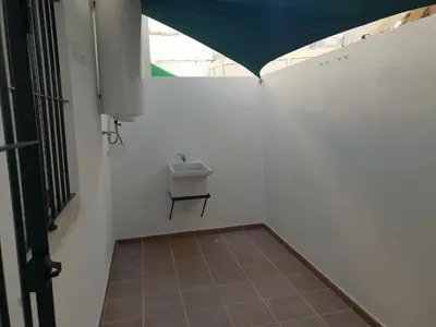 a small bathroom with a sink in a wall at Chipiona Acogedor LA in Chipiona