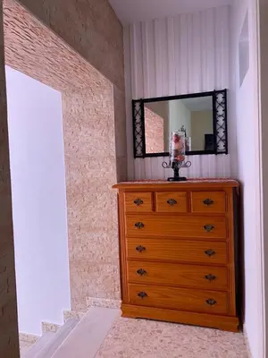 a dresser with a mirror on top of it at MyChoice Blas Infante in Rota