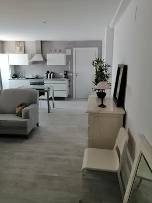 a living room with a couch and a table at Hormaza Chiclana in Chiclana de la Frontera
