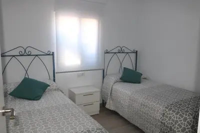 two beds sitting next to each other in a bedroom at Naveros Bajo in Los Naveros