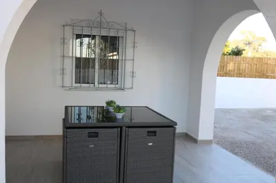 a black cabinet in a room with a window at Naveros Bajo in Los Naveros